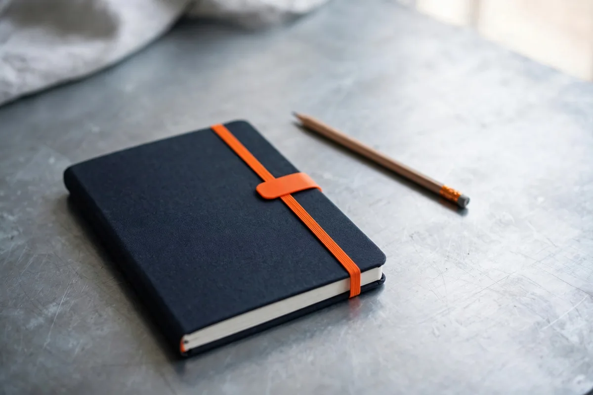 A calendar-free planner and a pencil on steel